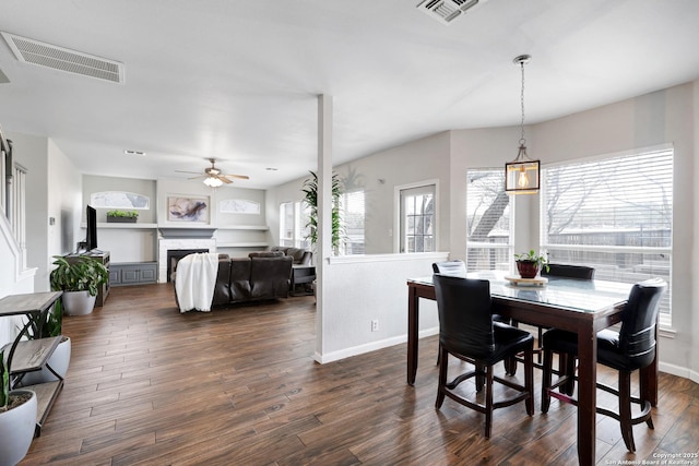 dining area featuring ceiling fan and dark hardwood / wood-style floors