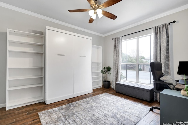 home office featuring ceiling fan, dark hardwood / wood-style flooring, and crown molding