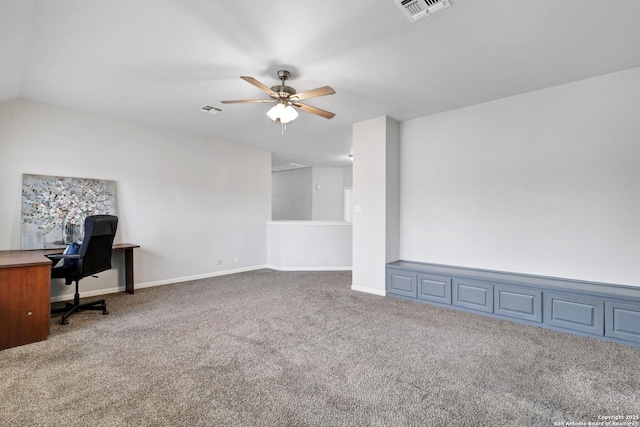 unfurnished office featuring carpet, ceiling fan, and lofted ceiling