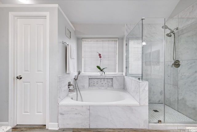 bathroom featuring shower with separate bathtub and lofted ceiling