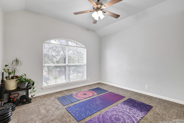 exercise area with a healthy amount of sunlight, carpet floors, and lofted ceiling