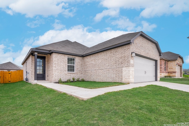 view of front facade featuring a front yard and a garage