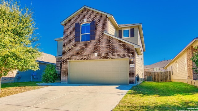 front facade with a garage, a front yard, and central AC