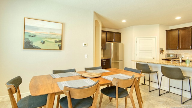 dining area featuring sink