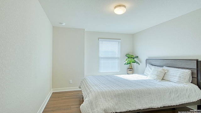 bedroom featuring dark hardwood / wood-style floors