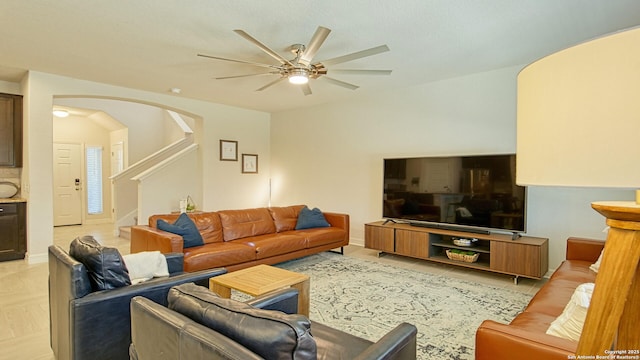 living room with ceiling fan and light tile patterned floors