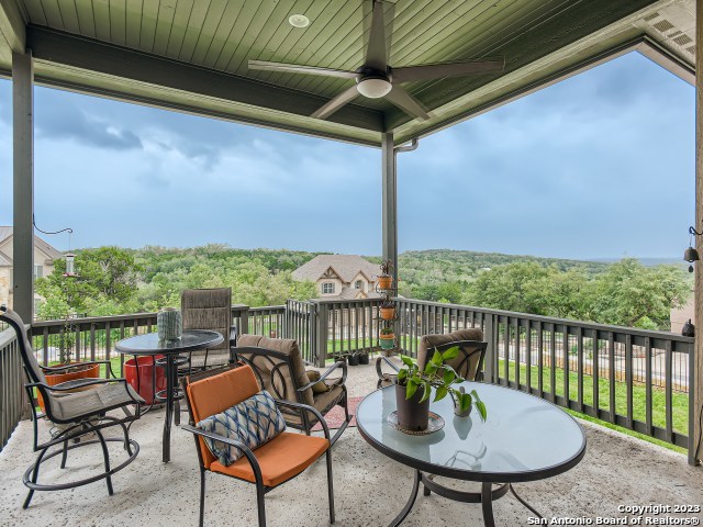 exterior space featuring ceiling fan