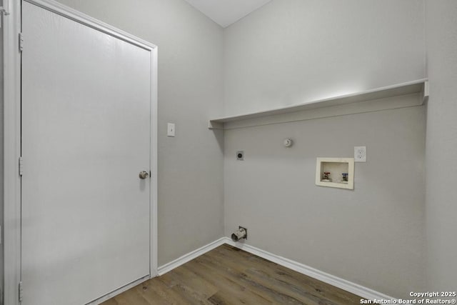 washroom featuring hookup for an electric dryer, hookup for a gas dryer, hardwood / wood-style floors, and hookup for a washing machine