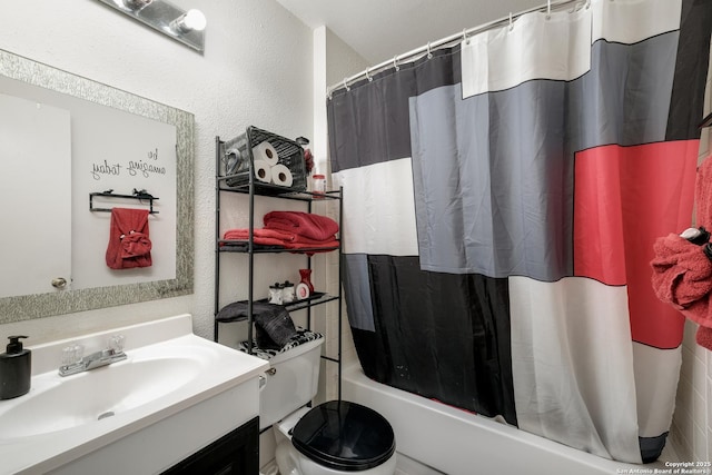 full bathroom with shower / bath combo with shower curtain, vanity, and toilet