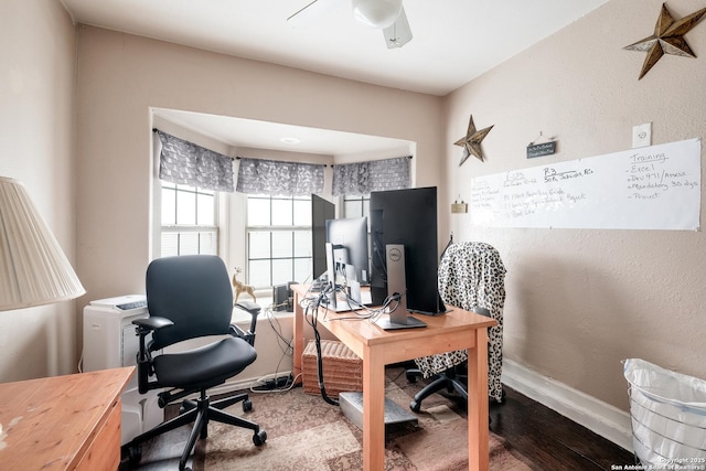 office with ceiling fan and hardwood / wood-style flooring