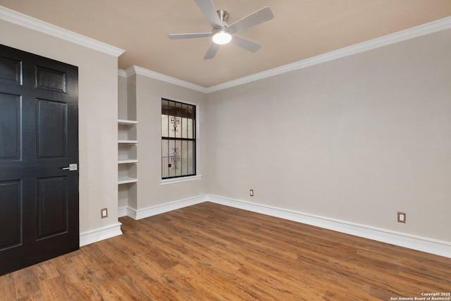 unfurnished room featuring ceiling fan, hardwood / wood-style floors, built in features, and crown molding