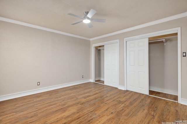 unfurnished bedroom featuring ceiling fan, crown molding, and wood-type flooring