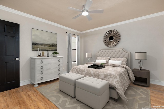 bedroom with light wood-type flooring, ceiling fan, and crown molding