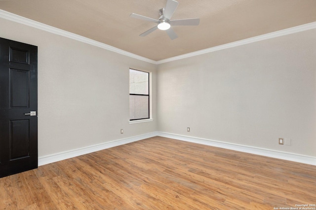 spare room featuring ceiling fan, ornamental molding, and light hardwood / wood-style flooring