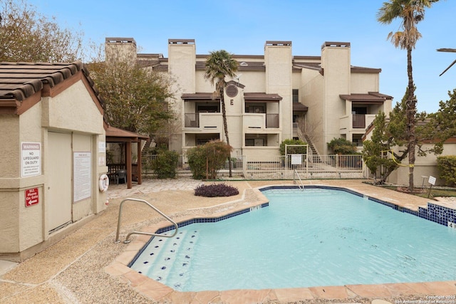 view of swimming pool with a patio area