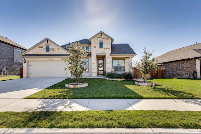 view of front of home featuring a front yard and a garage