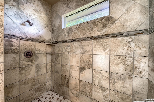 bathroom featuring tiled shower