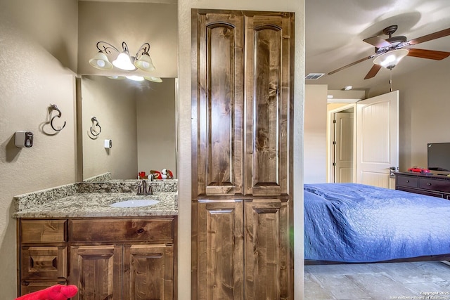 bathroom featuring ceiling fan and vanity