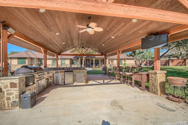 view of patio / terrace with ceiling fan and area for grilling