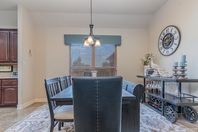 dining space with a chandelier