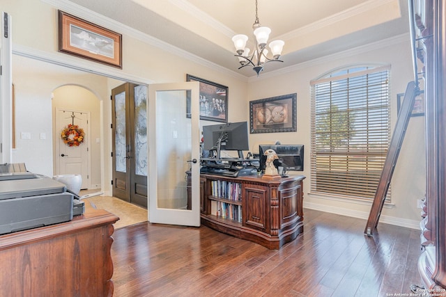 office space featuring a chandelier, dark hardwood / wood-style flooring, crown molding, and french doors