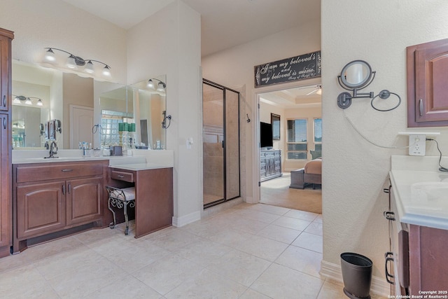 bathroom with vanity, tile patterned floors, and a shower with door