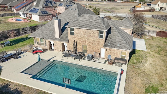 view of pool featuring a patio and central air condition unit