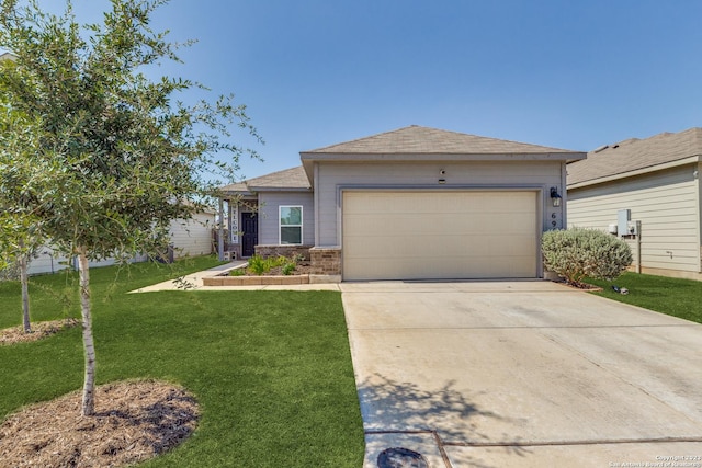 view of front of house featuring a garage and a front lawn