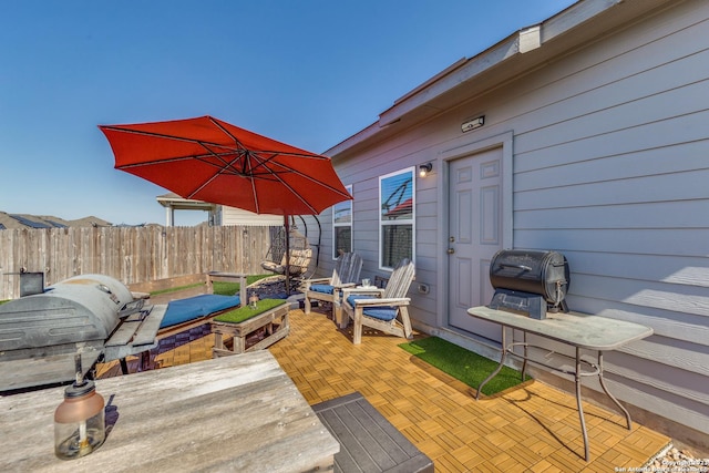 view of patio featuring a grill