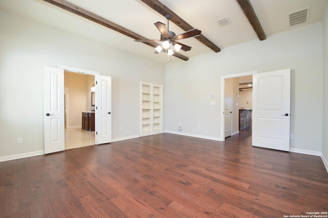604 Hannahs Run, New Braunfels, TX 78130 - unfurnished bedroom with dark wood-style floors, beam ceiling, baseboards, and ensuite bathroom