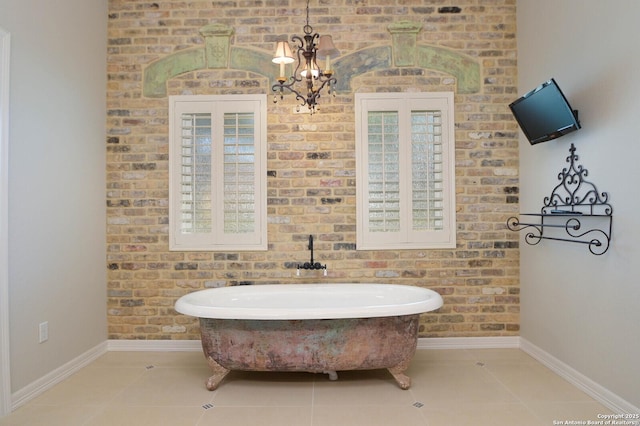 604 Hannahs Run, New Braunfels, TX 78130 - bathroom featuring baseboards, a soaking tub, and tile patterned flooring