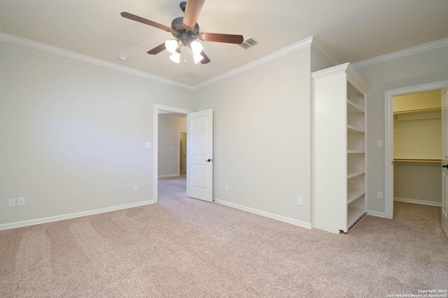 604 Hannahs Run, New Braunfels, TX 78130 - unfurnished bedroom with carpet, crown molding, a walk in closet, and baseboards