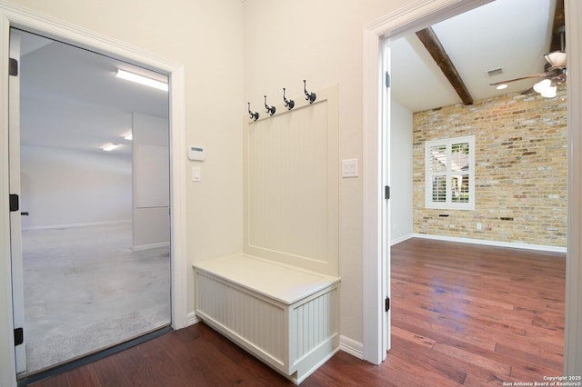 604 Hannahs Run, New Braunfels, TX 78130 - mudroom featuring baseboards, brick wall, dark wood finished floors, and beam ceiling