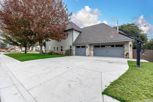 604 Hannahs Run, New Braunfels, TX 78130 - view of front of home with a shingled roof, driveway, stone siding, an attached garage, and stucco siding