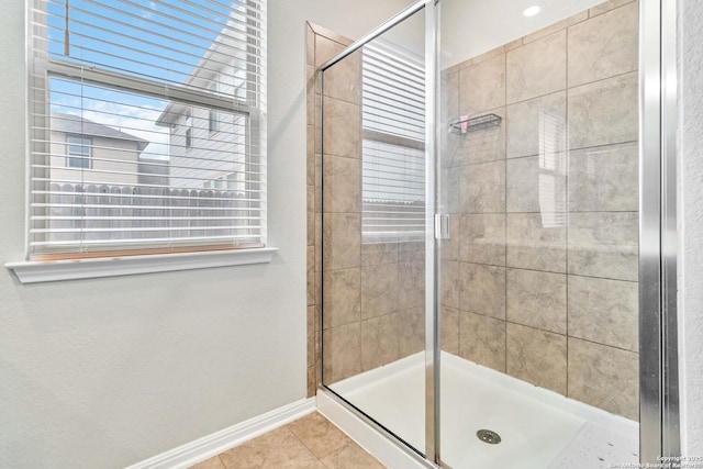 bathroom featuring tile patterned flooring and walk in shower