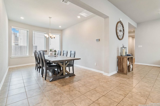 dining space with a chandelier and light tile patterned floors