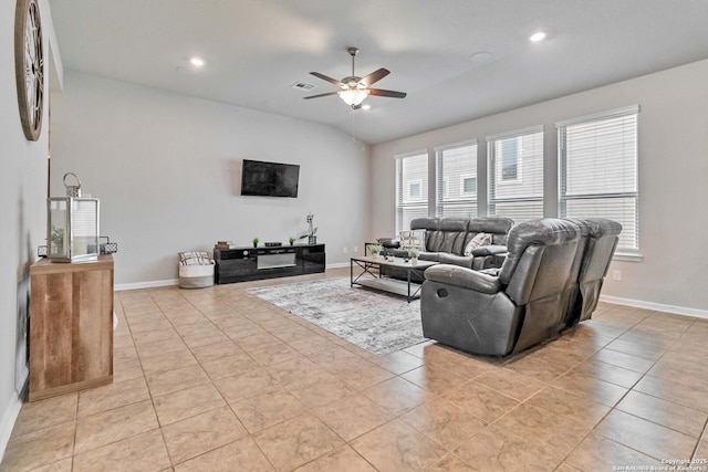 living room featuring ceiling fan and light tile patterned flooring