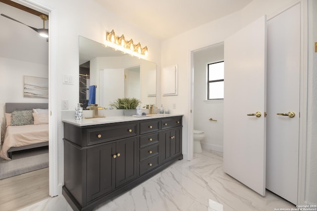 bathroom with vanity and toilet