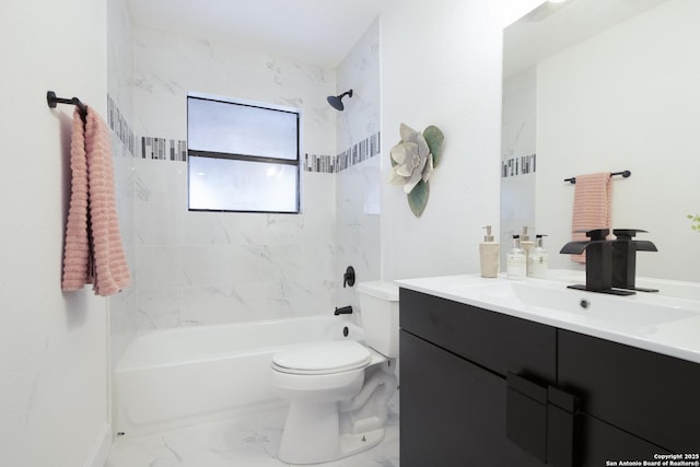 full bathroom with toilet, vanity, and tiled shower / bath