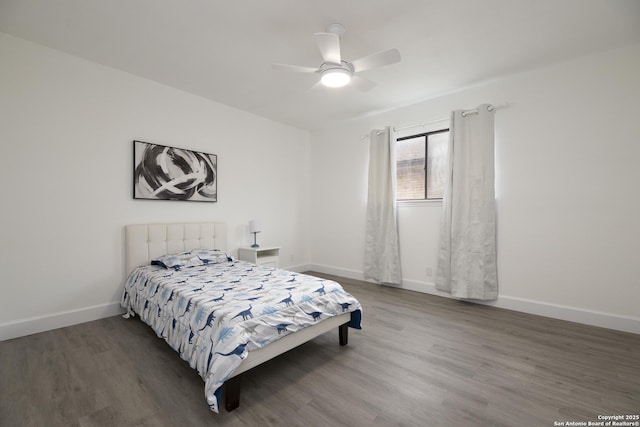 bedroom with wood-type flooring and ceiling fan