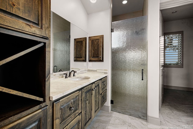 bathroom with a shower with door and vanity