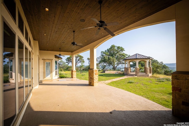 view of patio with a gazebo and ceiling fan