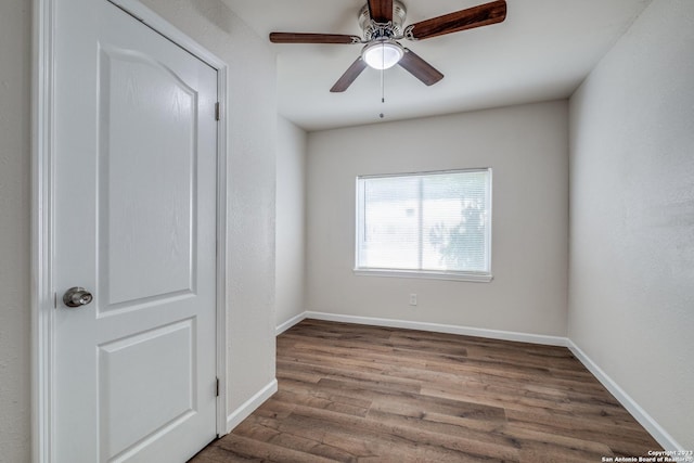 unfurnished room featuring hardwood / wood-style floors and ceiling fan