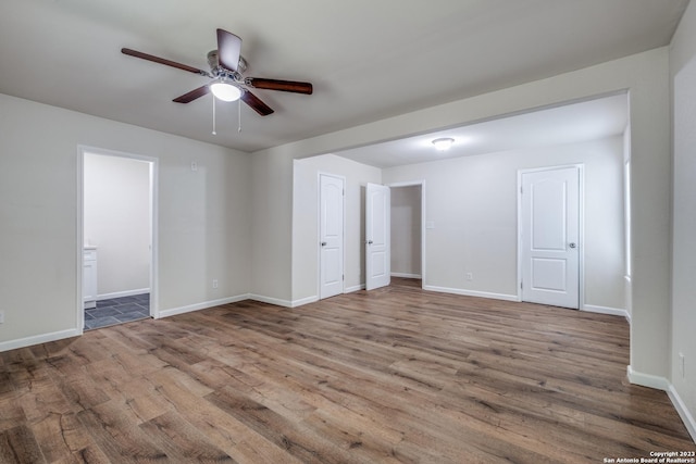 unfurnished room featuring ceiling fan and light hardwood / wood-style floors