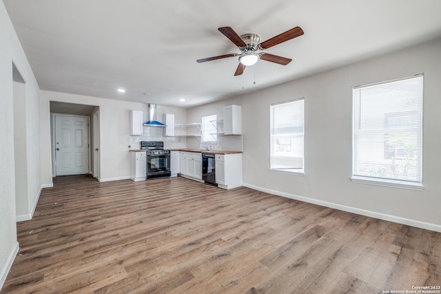 unfurnished living room featuring light wood-type flooring and ceiling fan