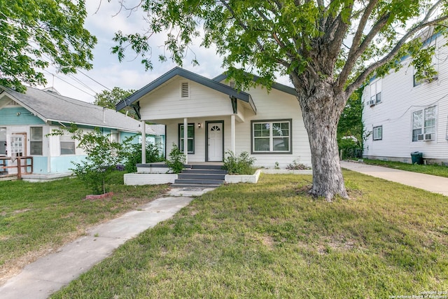 view of front facade with a front yard and a porch