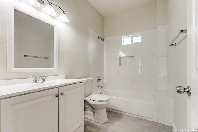 full bathroom featuring toilet, vanity, and tub / shower combination