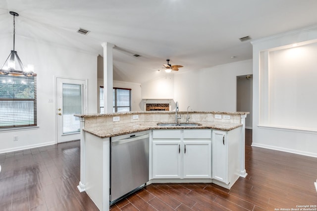 kitchen with sink, stainless steel dishwasher, an island with sink, decorative light fixtures, and white cabinetry