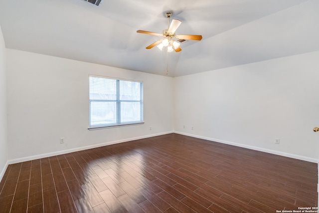 empty room with ceiling fan and lofted ceiling