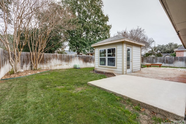 view of yard with an outdoor structure and a patio